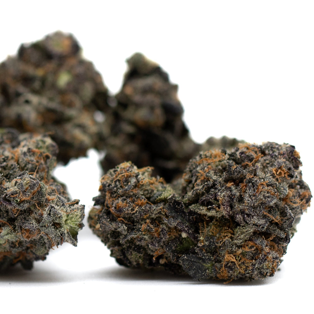 Dense dark cannabis buds of Poppin Bottlez Indoor THCa Flower